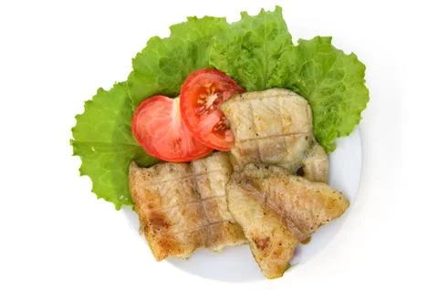 Fish grilled with tomatoes Stock Photos