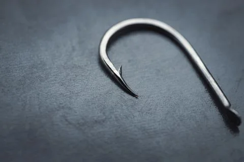 Fish hook on a black background, close-up Stock Photos
