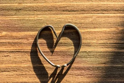 Fish hook heart. Stock Photos
