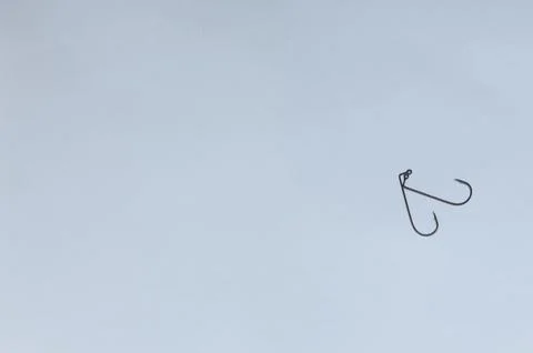 Fish hook with shiny bait Stock Photos