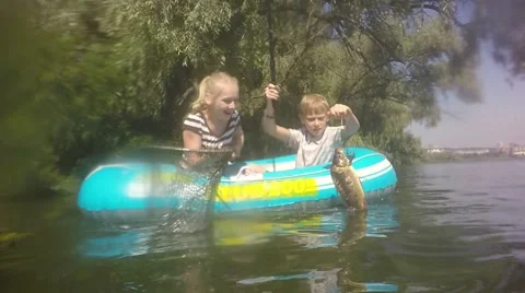 Fish on the hook. Turbid water in the river. Slow motion. Video stock 66774034