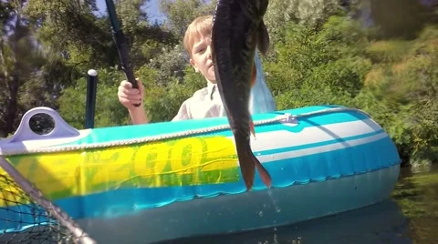 Fish on the hook. Turbid water in the river. Stockbeeldmateriaal 66774038