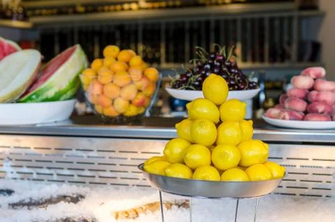 Fish on ice with fruit Stock Photos