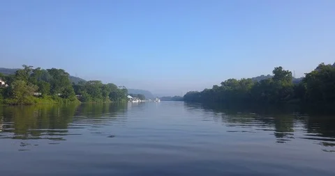 Fish Jumping On A Calm Blue River Vídeo Stock 92703068