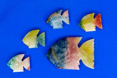 Fish made of stone on a colored background Foto stock