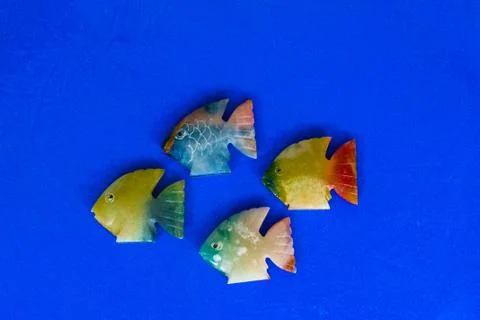 Fish made of stone on a colored background Foto stock