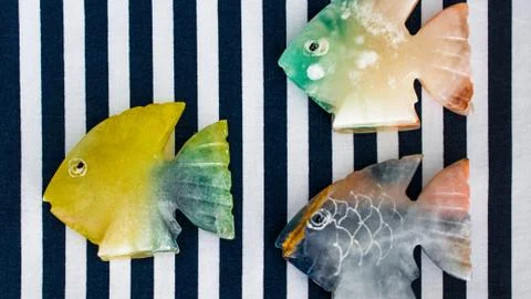 Fish made of stone on a colored background Foto stock