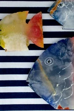 Fish made of stone on a colored background Foto stock