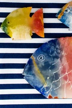 Fish made of stone on a colored background Foto stock