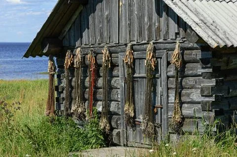 Fish nets on the shed wall Stock Photos
