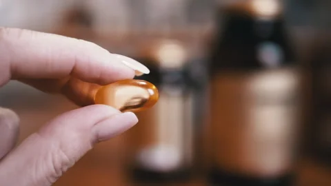 Fish Oil Capsule Close Up Stock Footage 312004051