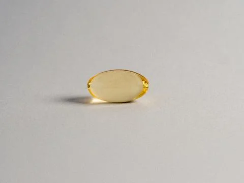 Fish oil supplement omega 3 capsule isolated on white background - Image Stock Photos