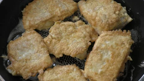 Fish in a pan fried cod close-up Stock Footage 159737833