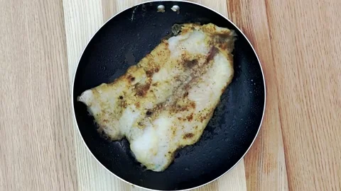 Fish in a pan1 Stock Footage 201347963
