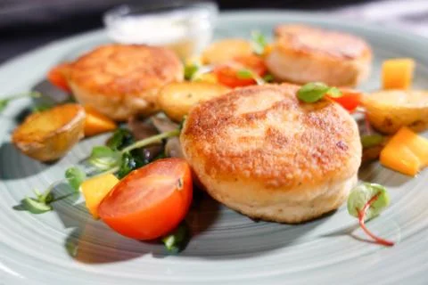 Fish patties with a side dish Stock Photos