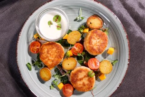 Fish patties with a side dish Stock Photos