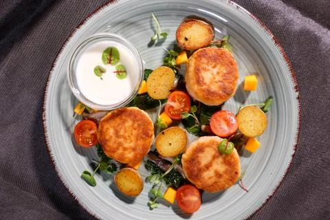 Fish patties with a side dish Stock Photos