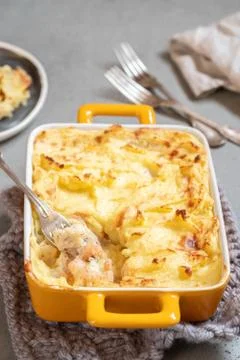 Fish pie topped with mashed potato Stock Photos