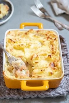 Fish pie topped with mashed potato Stock Photos