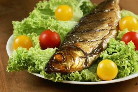 Fish on plate Stock Photos