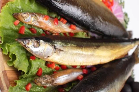 Fish on plate with red pepper Stock Photos