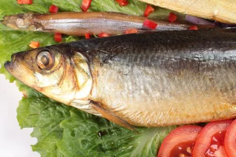 Fish on plate with red pepper Stock Photos