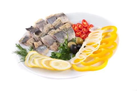 Fish on plate with vegetables Stock Photos