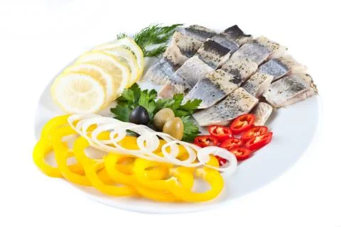 Fish on plate with vegetables Stock Photos