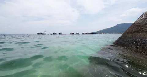 Fish point for snorkeling and diving with many anchored boats, reveal shot Stock Footage 314637635