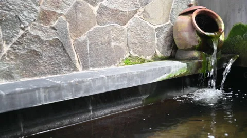 Fish pond with clay water jug waterfall view Stock Footage 150074792