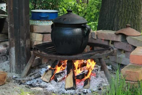 Fish pot and fire Stock Photos