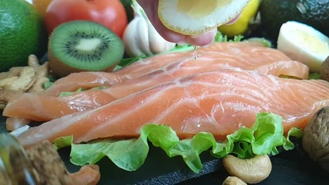 Fish red, pour lemon Stock-Footage 87697268