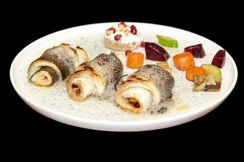 Fish rolls with vegetables. Fish dish in a restaurant Stock Photos