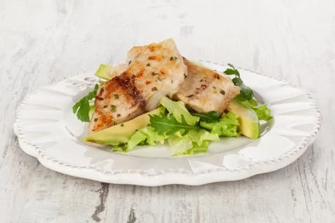 Fish with salad. Stock Photos