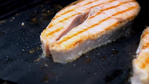 Fish salmon cuts being grilled Stock Footage 130063684