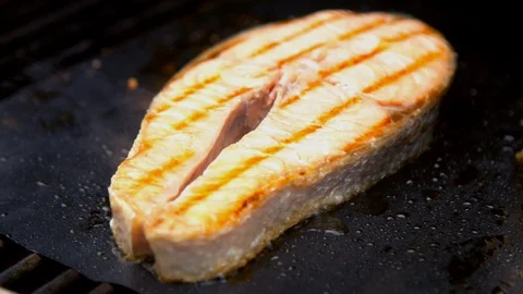 Fish salmon cuts being grilled Stock Footage 130066724