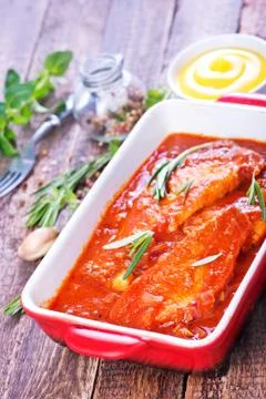 Fish with sauce Stock Photos