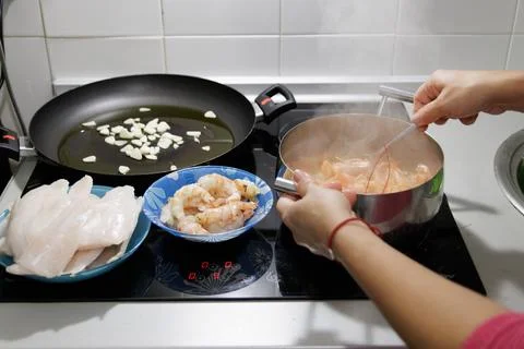 Fish in sauce with shrimp. Step by step preparation. Fumet with shrimp shells Stock Photos