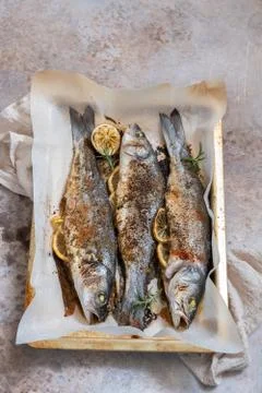 Fish seabass roasted with lemon Stock Photos
