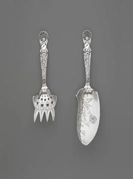 Fish Serving Knife and Fork, Dolphin Pattern. Manufacturer: Tiffany and C.. Stock Photos