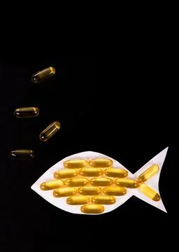 Fish shape Cod Liver Oil Capsules, Omega 3 Stock Photos