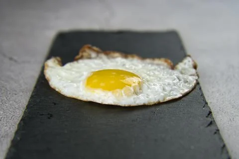 Fish-shaped fried egg Stock Photos