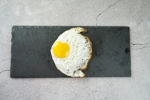 Fish-shaped fried egg Stock Photos