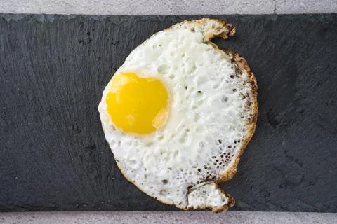 Fish-shaped fried egg Stock Photos