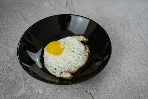 Fish-shaped fried egg Stock Photos