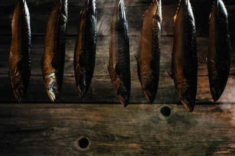 Fish Smoking Process For Home Use. fish hanging side by side in a smoker. S.. Stock Photos