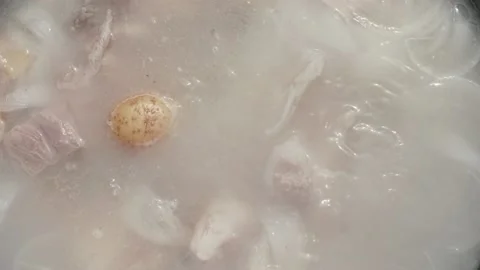 Fish soup is boiled in a cauldron on fire Stock Footage 228866749