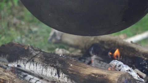 Fish soup is cooked on a fire 動画素材 140382007
