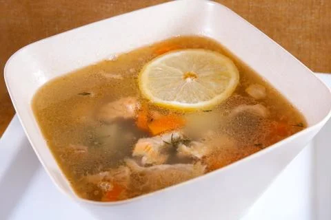 Fish soup with slice of lemon Stock Photos