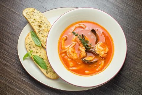 Fish soup with tomatoes and mussels Stock Photos